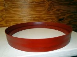 Type II solid manhole riser, a red steel ring